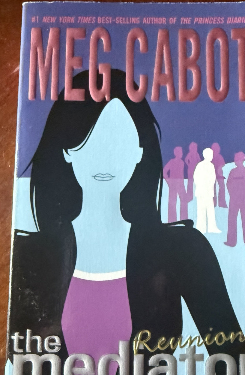 Front cover of Reunion by Meg Cabot, Book 3 in The Mediator series, featuring a dark-haired woman among ghostly figures.