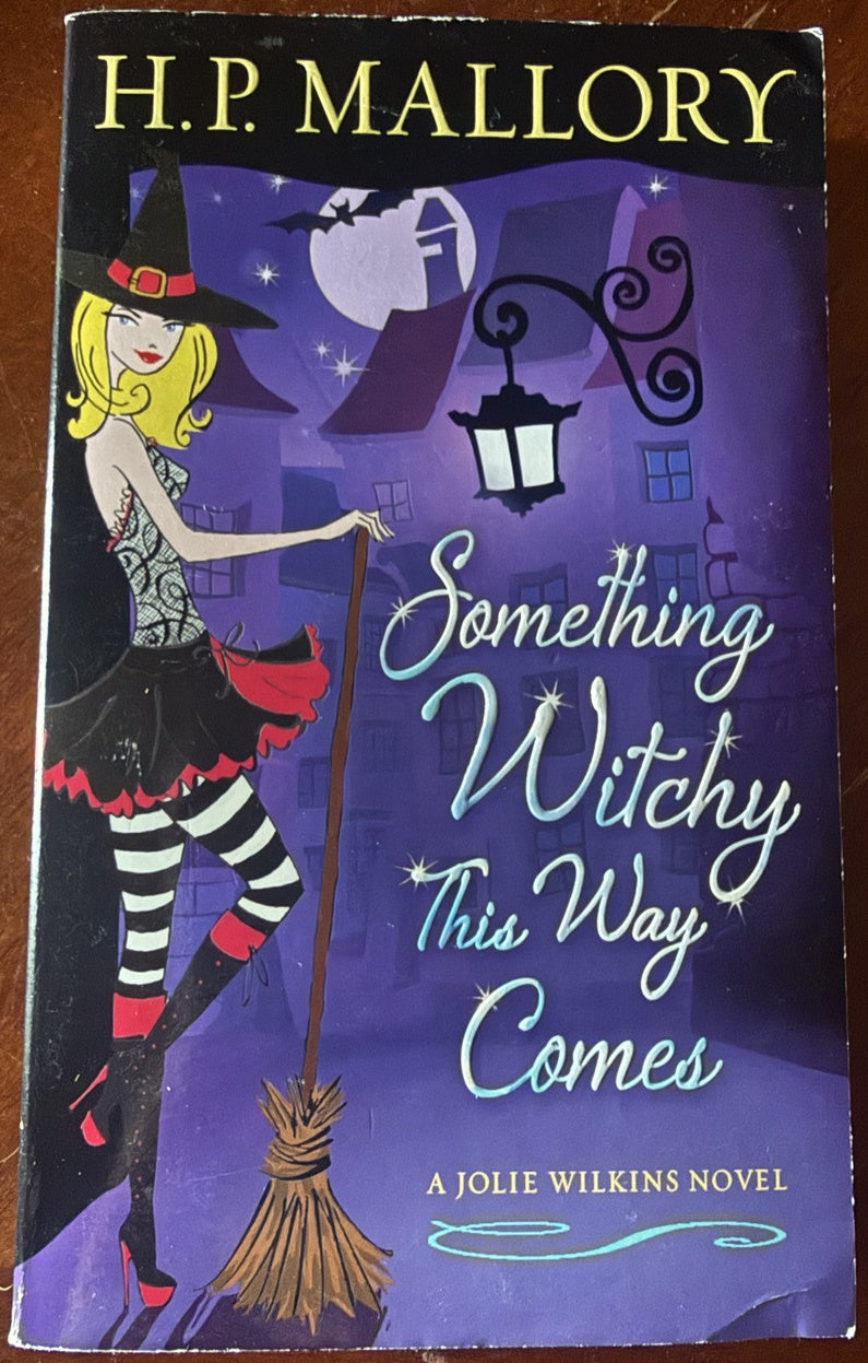 Front cover of Something Witchy This Way Comes: A Jolie Wilkins Novel by H. P. Mallory