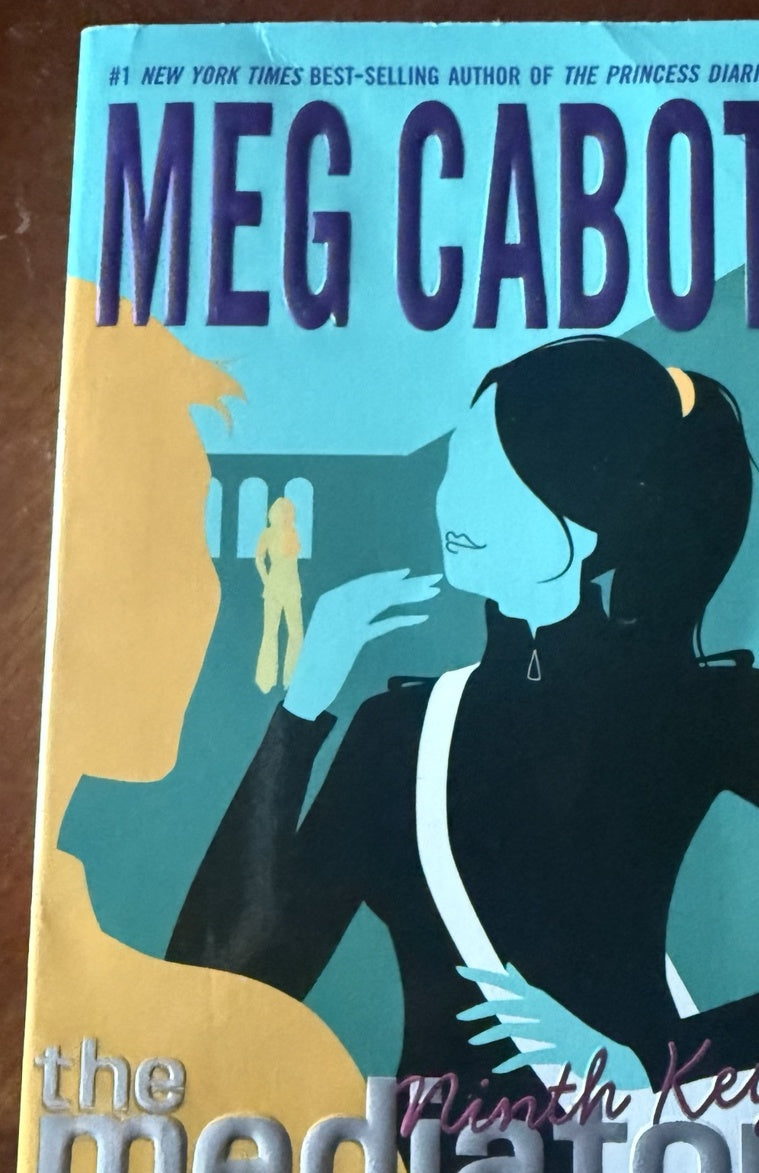 Front cover of The Ninth Key by Meg Cabot, Book 2 in The Mediator series, featuring Suze and a ghost against a blue and yellow background.