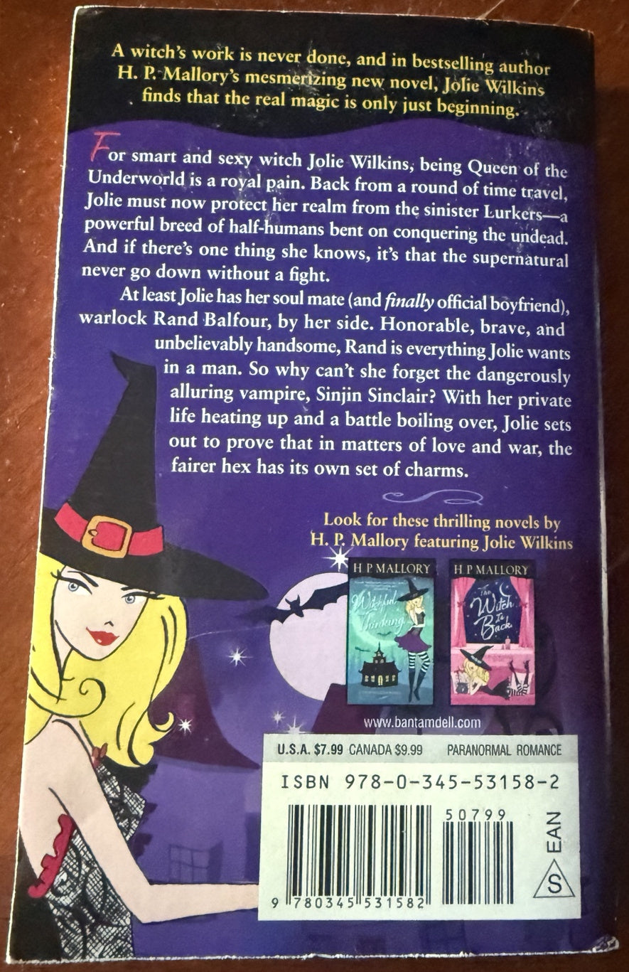 Back cover of Something Witchy This Way Comes: A Jolie Wilkins Novel by H. P. Mallory